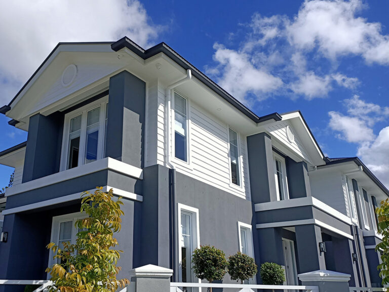 Hamptons style exterior features and architectural mouldings gold coast Australia Horizontal banding mouldings defining levels on a rendered home